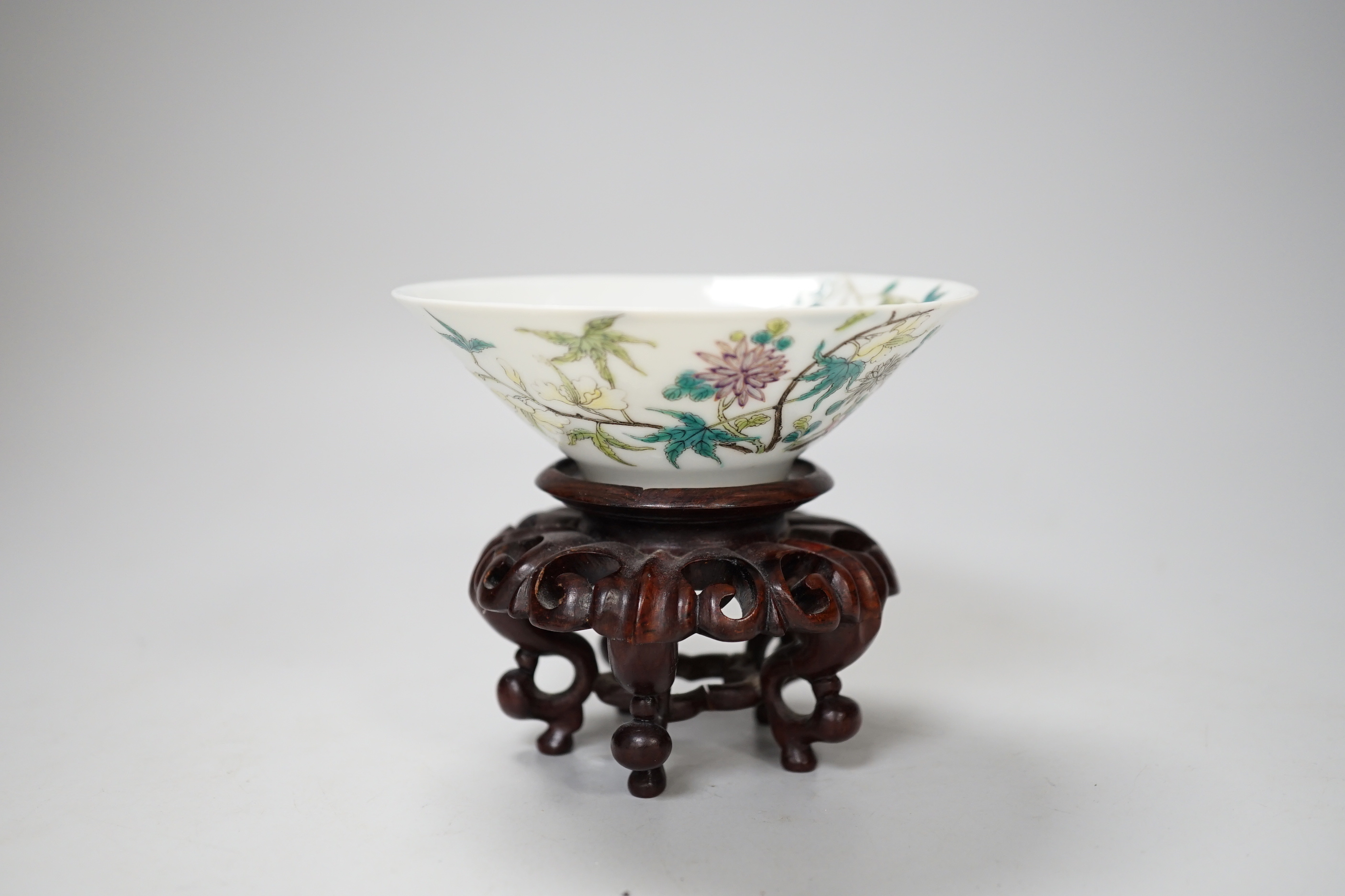A Chinese famille rose conical bowl, Xuande mark but Republic period, wood stand 10cm diameter